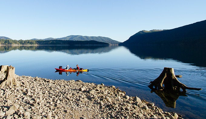 OL-Lake-Kayak-stumps_JBailie_680 Kayaking on lake in Olympic National Park.