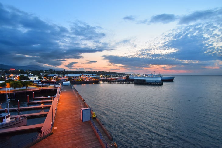 The ferry docking in Port Angeles, Washington at sunset