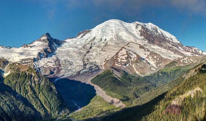 MtRainier-PeakFromEmmonsVista-SunriseArea_DP_700 The glaciated Peak of Mount Rainier in summer from Emmons Vista overlook with a great view of Emmons Glacier, Sunrise area of Mount Rainier National…